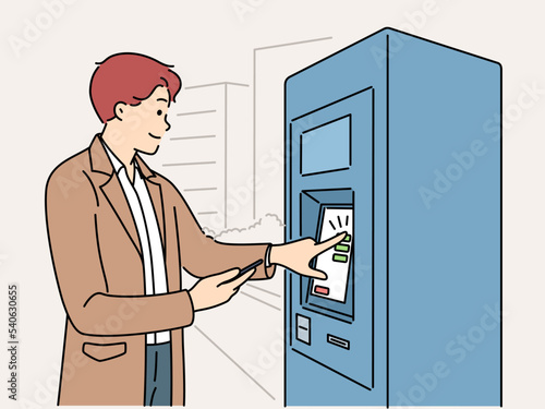 Man buy tickets from machine 