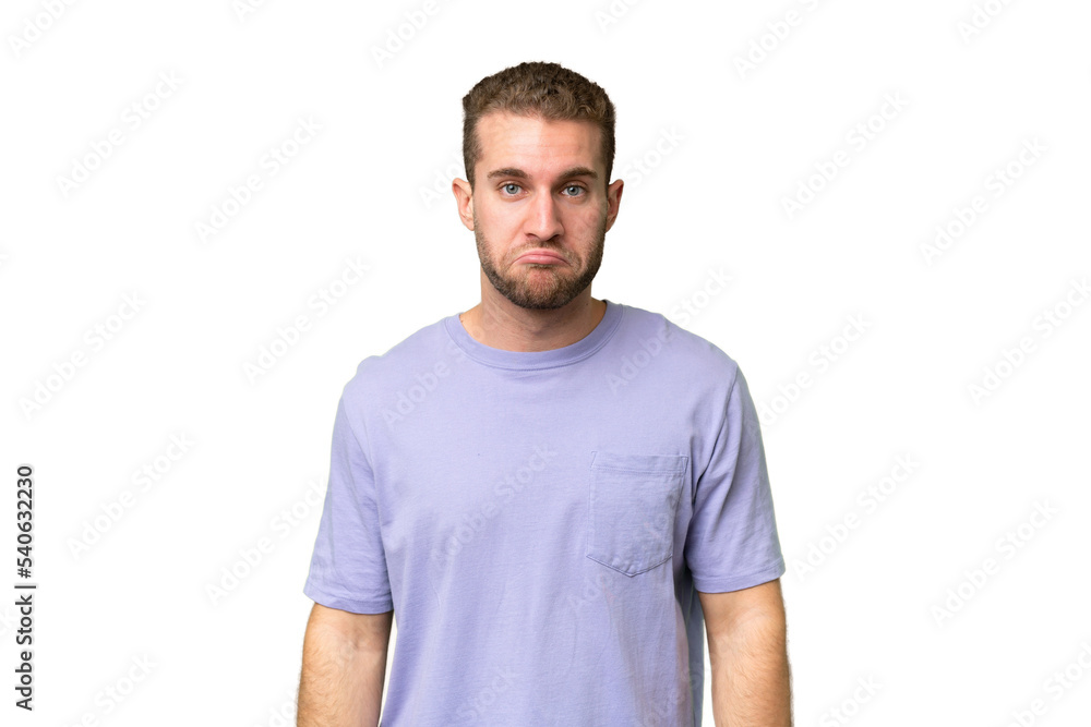 Young handsome caucasian man isolated on green chroma background with sad expression Young handsome caucasian man isolated on green chroma background with sad expression