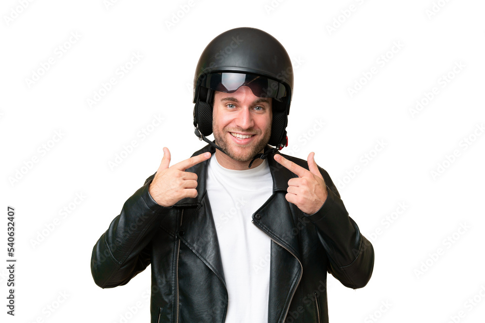 Young caucasian man with a motorcycle helmet isolated on green chroma background giving a thumbs up gesture Young caucasian man with a motorcycle helmet isolated on green chroma background giving a thumbs up gesture
