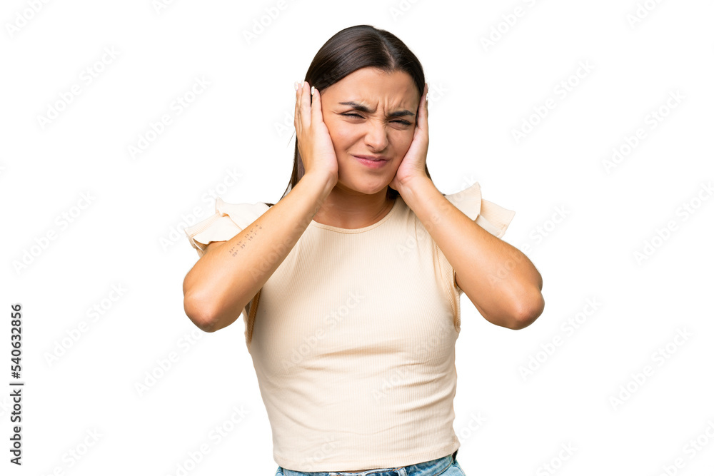 Young caucasian woman isolated on green chroma background frustrated and covering ears Young caucasian woman isolated on green chroma background frustrated and covering ears