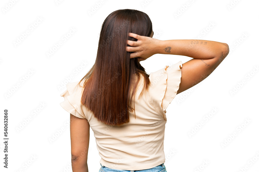 Young caucasian woman isolated on green chroma background in back position and thinking Young caucasian woman isolated on green chroma background in back position and thinking