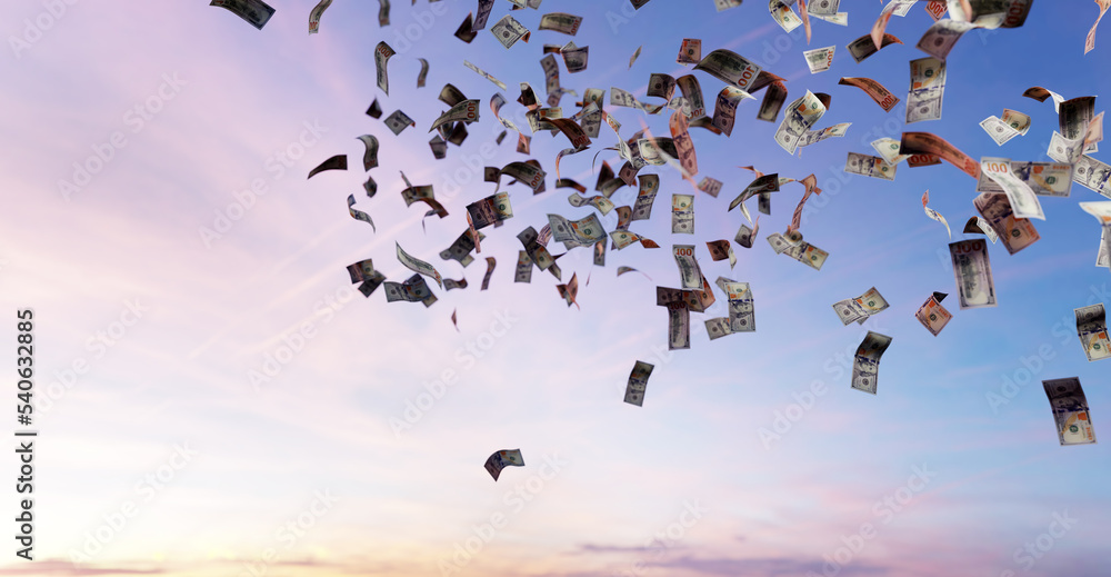 Fototapeta premium Money falling from sky - one hundred US dollar bills.