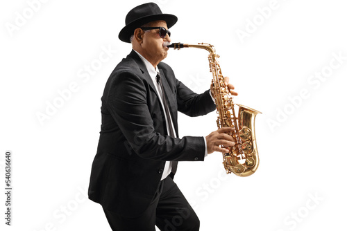 Mature male sax player with sunglasses performing