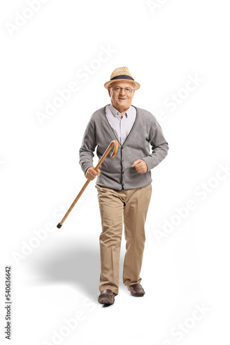 Full length portrait of a senior man walking and smiling