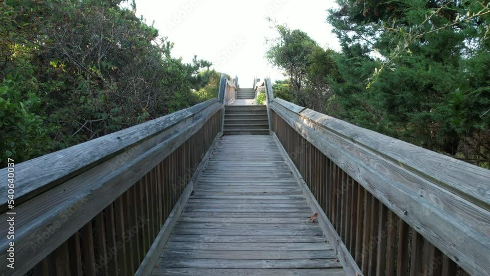 Shot moving down walkway to the ocean in Emerald Isle, North Carolina Shot moving down walkway to the ocean in Emerald Isle, North Carolina