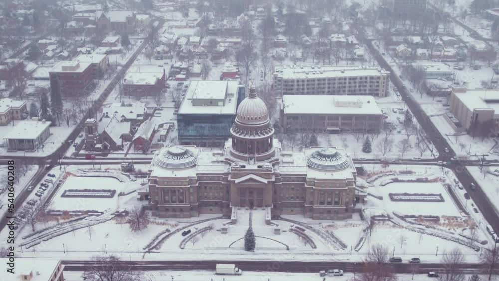 Aerial view of a snow covered landscape in boise, idaho with the capital building sitting prominently in the middle. Aerial view of a snow covered landscape in boise, idaho with the capital building sitting prominently in the middle.