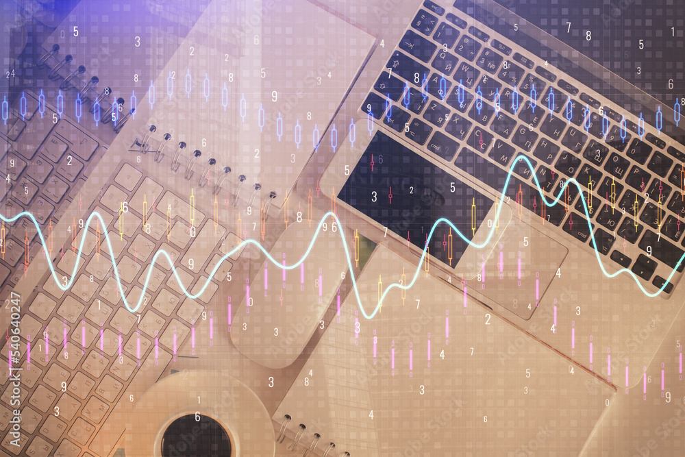 Financial market graph and top view computer on the desktop background. Multi exposure. Investment concept. Financial market graph and top view computer on the desktop background. Multi exposure. Investment concept.