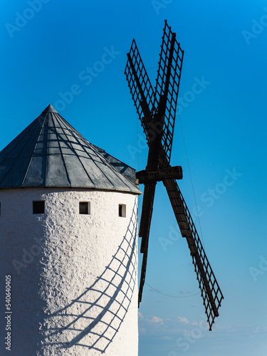 Spectacular old windmill with blue sky at sunset