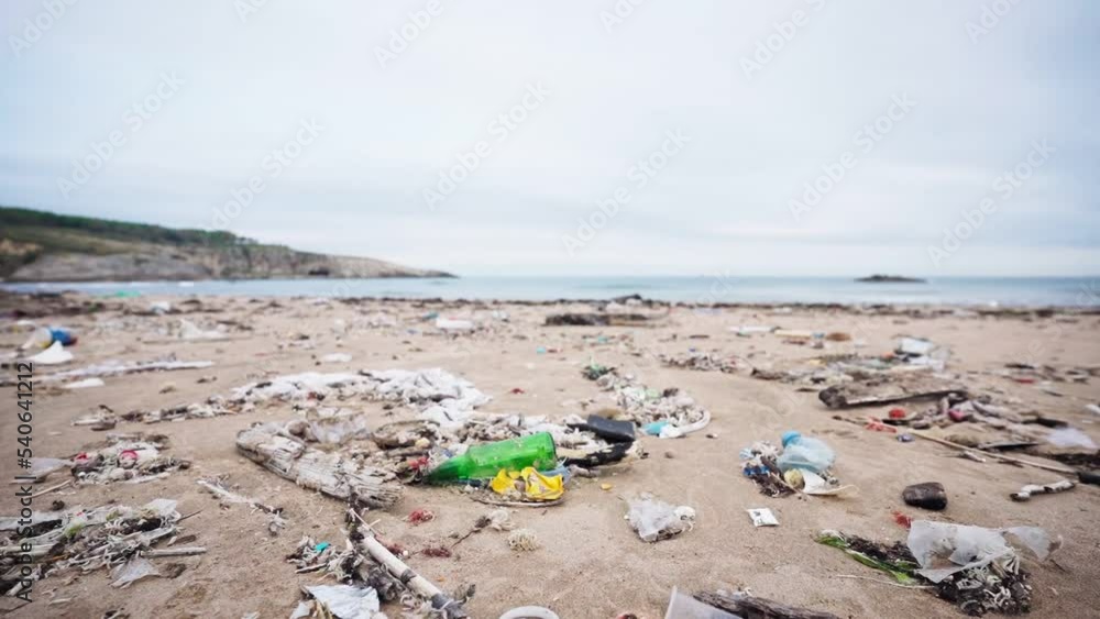 Plastic pollution of the sea shore. Polluted beach with plastic waste. Ecological problem concept. Plastic pollution of the sea shore. Polluted beach with plastic waste. Ecological problem concept.