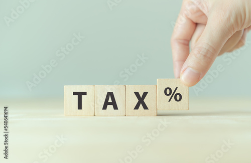 TAX concept, on wooden block. Including of state taxes,tax payment, governant ,calculating finance, tax accounting, statistics and data analytic reserach, calculation tax return, strategy plan, report