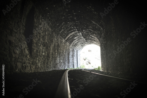 Old train tracks in a tunnel	