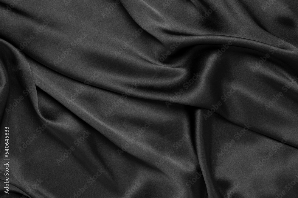 Fototapeta premium Abstract black background luxury cloth or liquid wave or wavy folds of grunge silk texture satin velvet material or luxurious