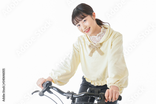 自転車に乗る若い女性 photo