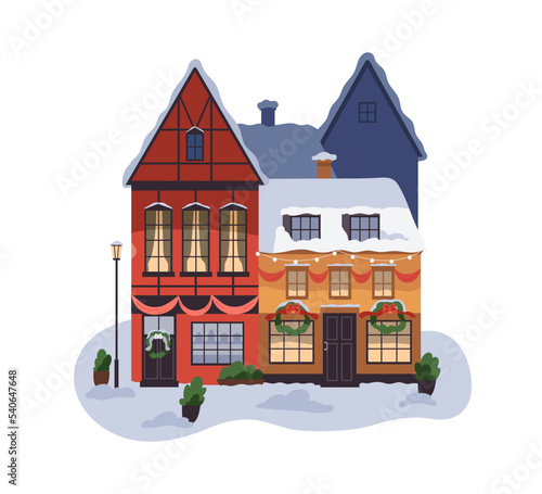 Christmas building facade with Xmas decoration, wreath and lights. House exte...