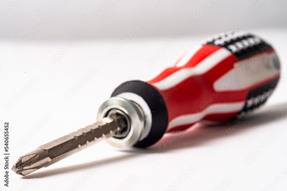 screwdriver with an American flag color handle on a white background screwdriver with an American flag color handle on a white background