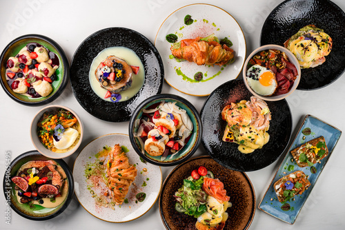 collection of breakfast dishes, a set table top view of a large set lunch