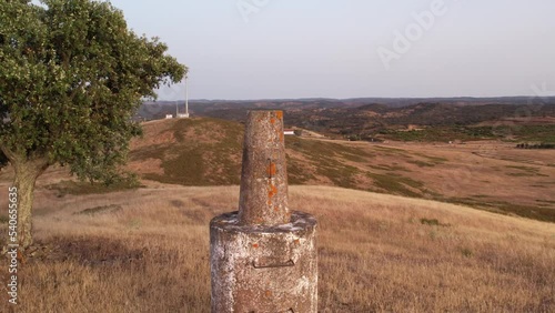 Geodesic landmark in Alentejo dry hilltop, Aerial orbiting shot photo