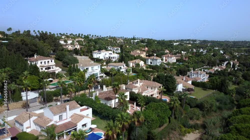 Drone shot flying over houses in beautiful Spanish countryside in summer Drone shot flying over houses in beautiful Spanish countryside in summer