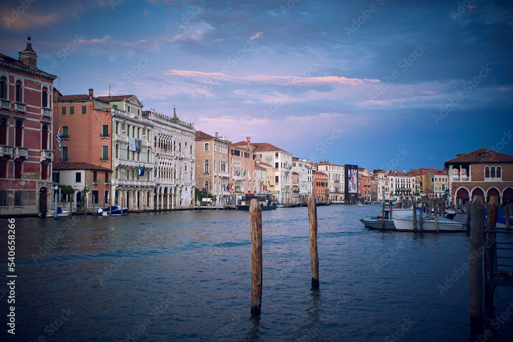 Traditional venetian houses and architecture style view across the Grand Canal in Venice, Italy. With Rialto market place on the right side
