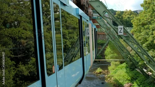 Germany, Wuppertal, Circa 2022. Wuppertal Suspension Railway in front of a train. photo