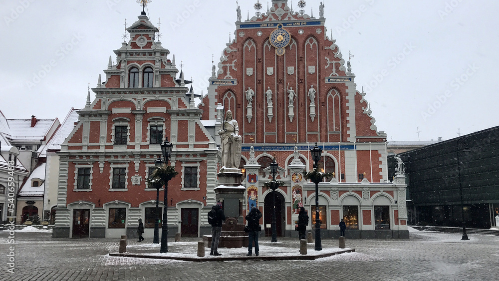 Riga, Latvia, February 2018 - A group of people in front of a building