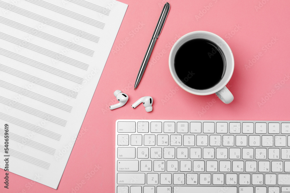 Notebook for writing notes and a cup of coffee on a pink background Notebook for writing notes and a cup of coffee on a pink background
