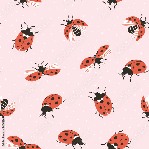 Vector insect seamless pattern. Hand-drawn ladybugs on the pink polka dots background. Vector spring illustration.