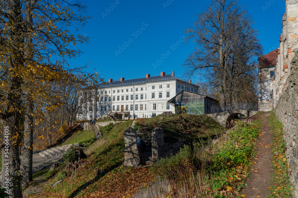 Castle and buildings of Gaujiena manor on a sunny autumn day, Latvia