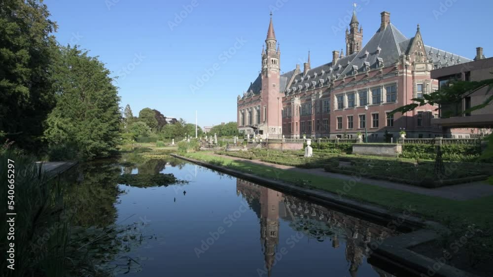 THE HAGUE, 10 August 2020 - Garden view from the pond and park of the most visited monument, Peace Palace on the pond in the garden of the International Court of Justice THE HAGUE, 10 August 2020 - Garden view from the pond and park of the most visited monument, Peace Palace on the pond in the garden of the International Court of Justice