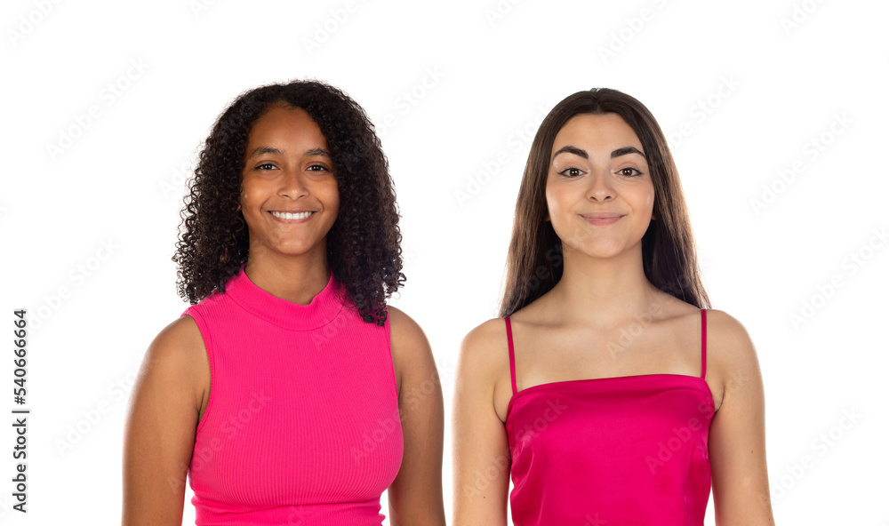 Photo of a positive smiling pleased young multiethnic girls friends posing in pink clothes