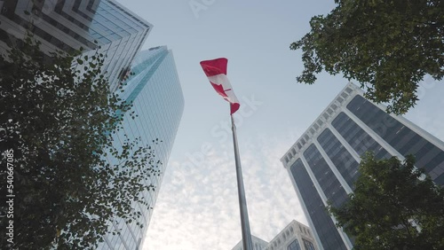 Corporate office building, Canadian flag waving, downtown business district, high rise skyscraper, downtown Vancouver. 4K 24FPS