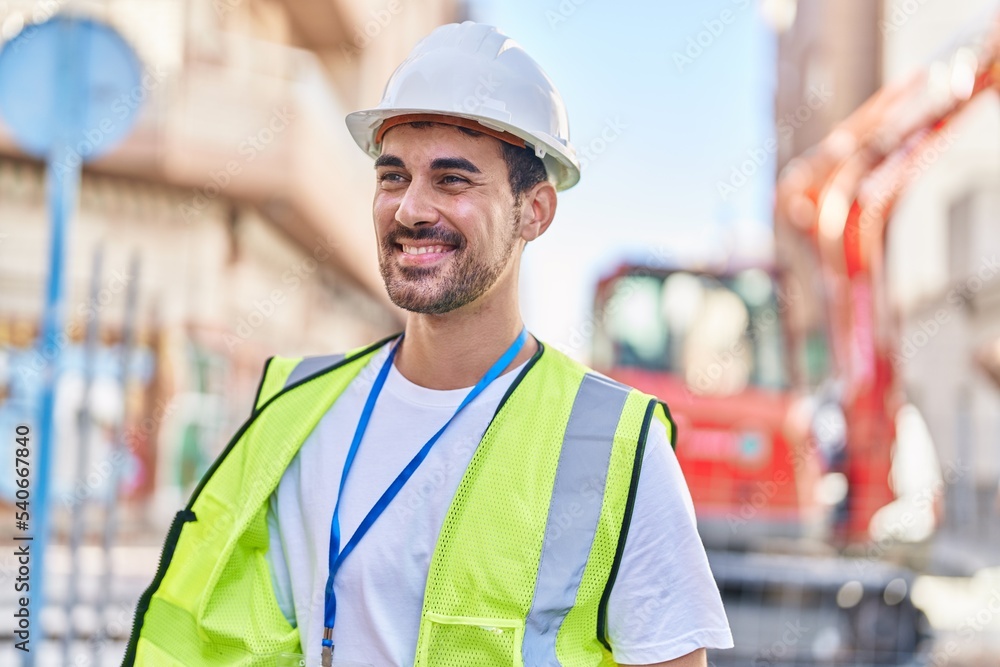 Young hispanic man architect smiling confident standing at street Young hispanic man architect smiling confident standing at street