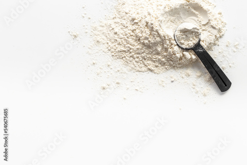 Whey protein powder on scoop. Fitness and gym diet nutrition