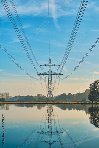 Power line in rural area with lake. High quality photo