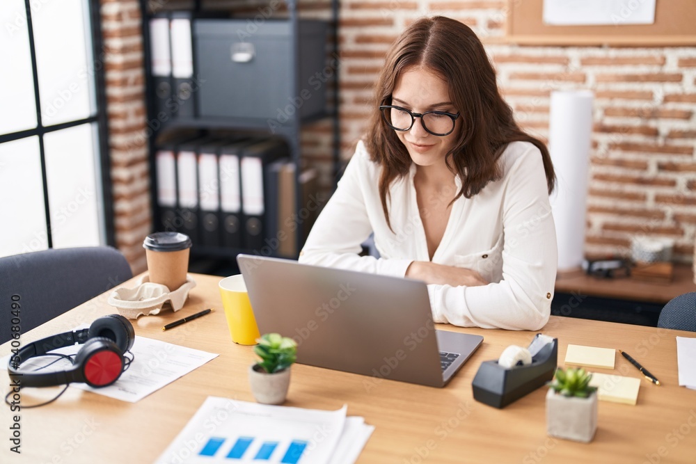 Young woman business worker using laptop working at office Young woman business worker using laptop working at office