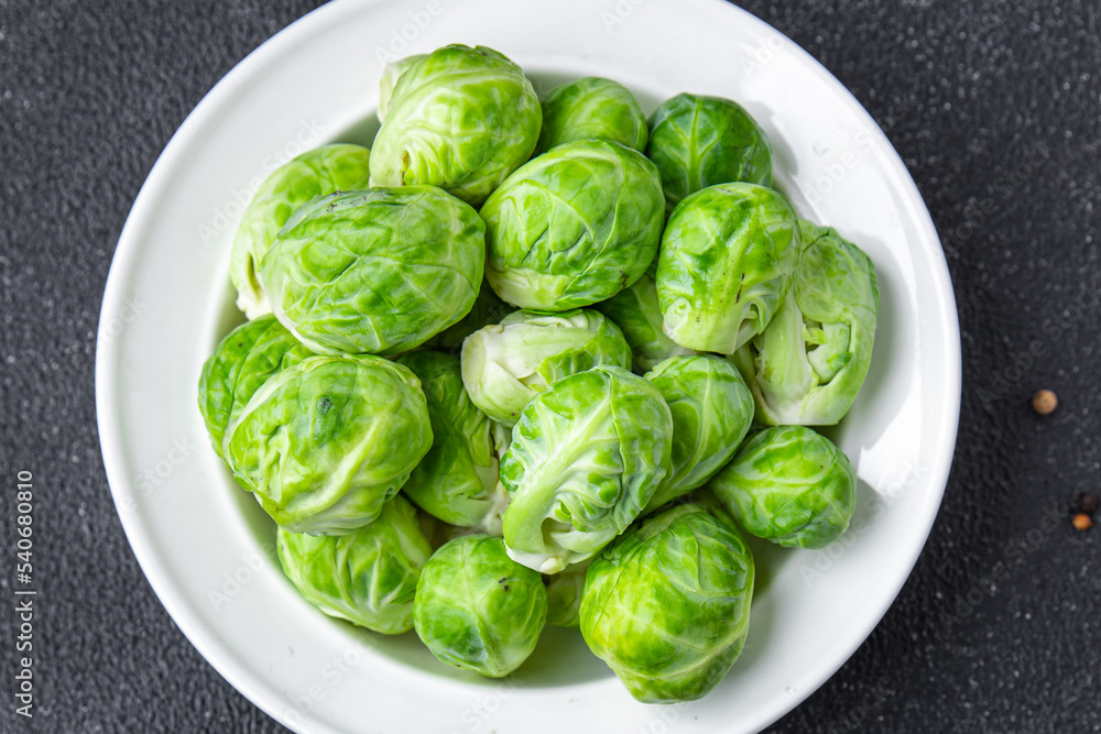 Obraz premium green Brussels sprouts raw vegetable food snack on the table copy space food background 