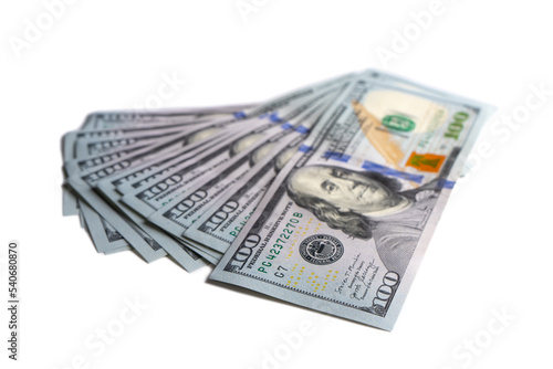 Pile of new design US dollar bills isolated on white background. Hundreds of dollar cash banknotes. Top view, flat lay. Business, finance, bank, currency, economy, wealth concept