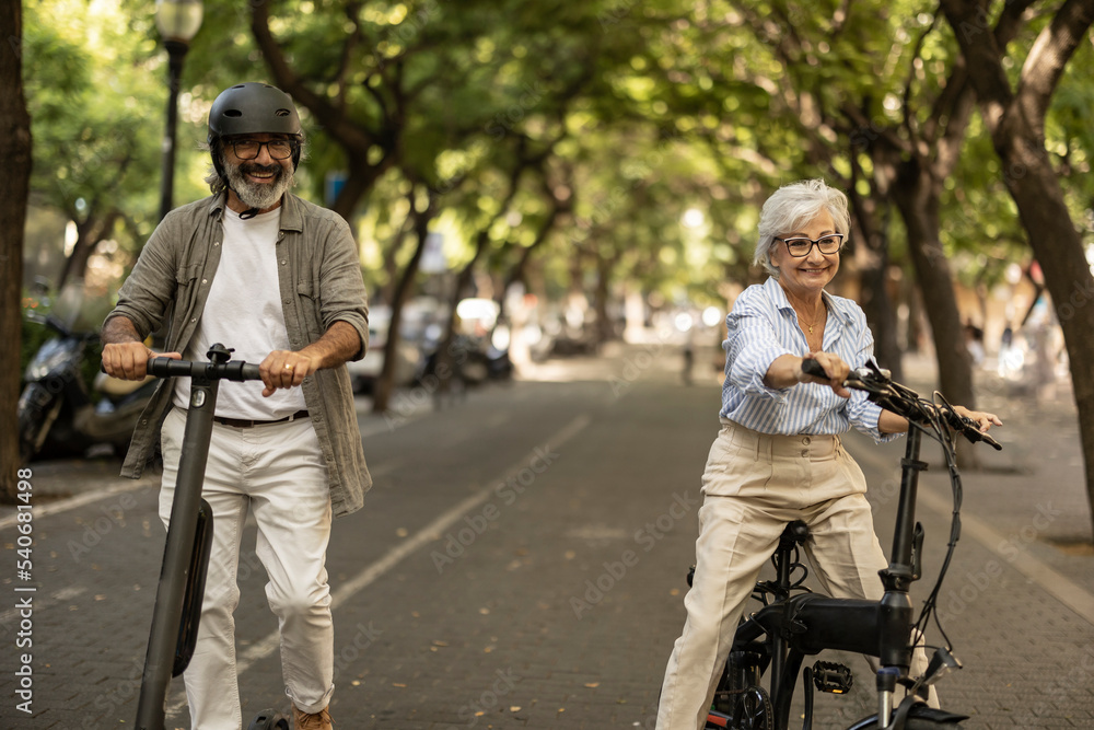 Senior couple has stopped after ride to have a conversation