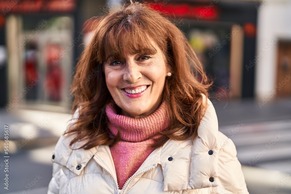 Middle age woman smiling confident standing at street Middle age woman smiling confident standing at street