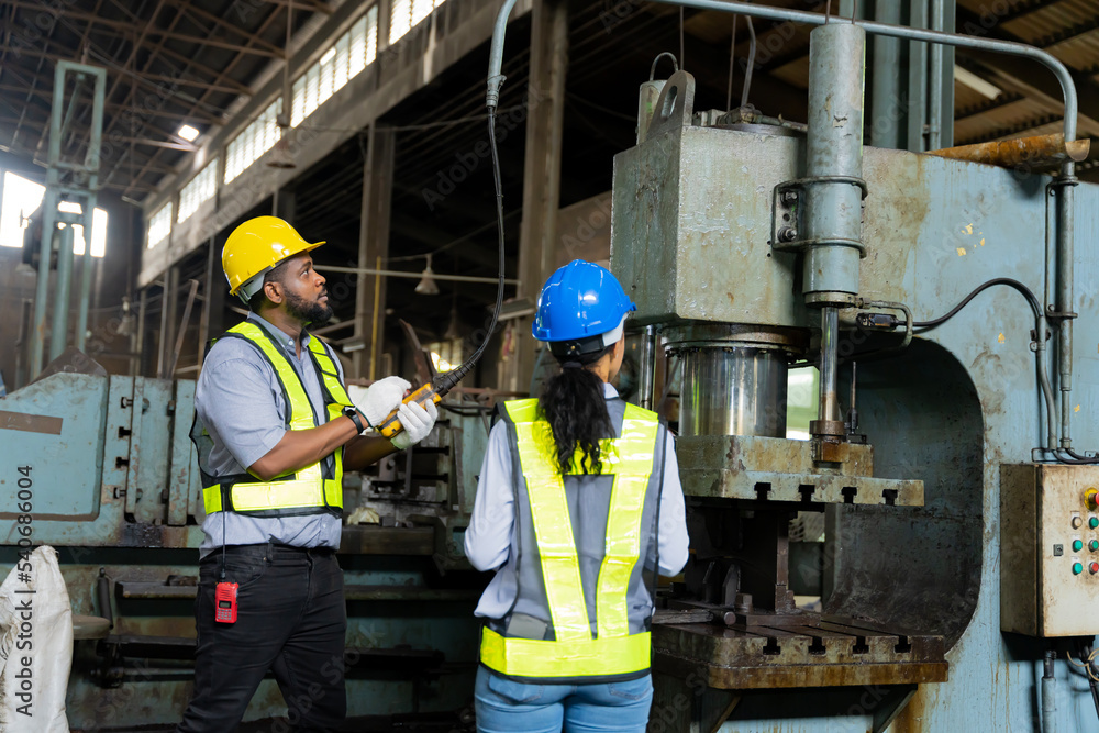 African male chief engineer Working in the old factory to rehearse the engine African male chief engineer Working in the old factory to rehearse the engine