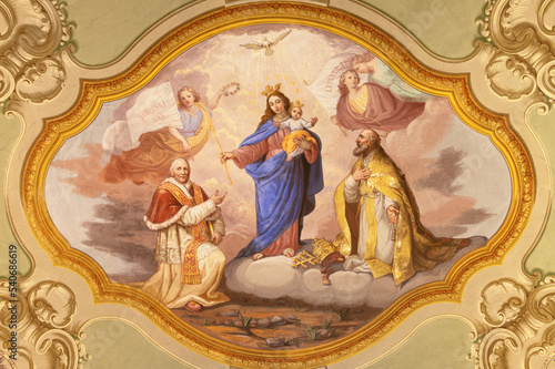 COURMAYEUR, ITALY - JULY 12, 2022: The ceiling fresco of Madonna among the saints in church in the church Sanctuary of Notre Dame de Guerison by Giuseppe Stornone (1816 - 1890).