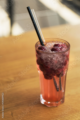 Glass of respberry lemonade isolated photo