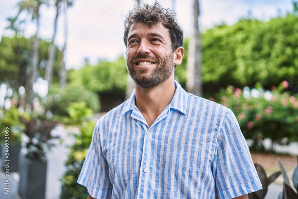 Young hispanic man smiling happy standing at the city. Young hispanic man smiling happy standing at the city.