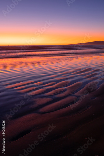 Beautiful beach sand pattern with sunrise light.