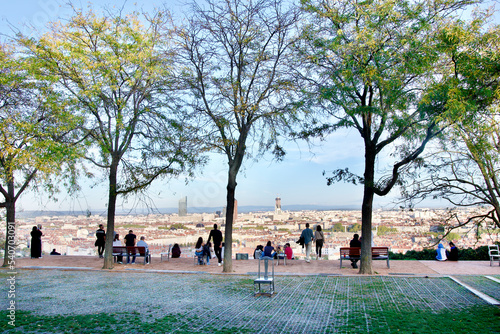 Photo of the garden of curiosities where people admire the magnificent view of the city of Lyon ( France ) that one sees in the second plan