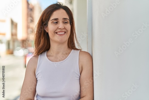 Young woman smiling confident standing at street Free Download Young woman smiling confident standing at street - GFXLoad