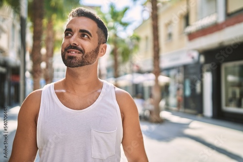 Hispanic sports man wearing workout style outdoors on a sunny day