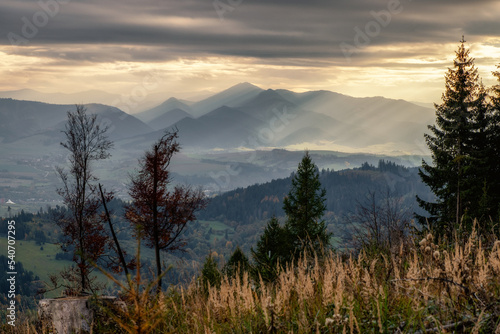 Sunshine through dark clouds. Cloudy sky sunrays. Sunrays in cloudy sky