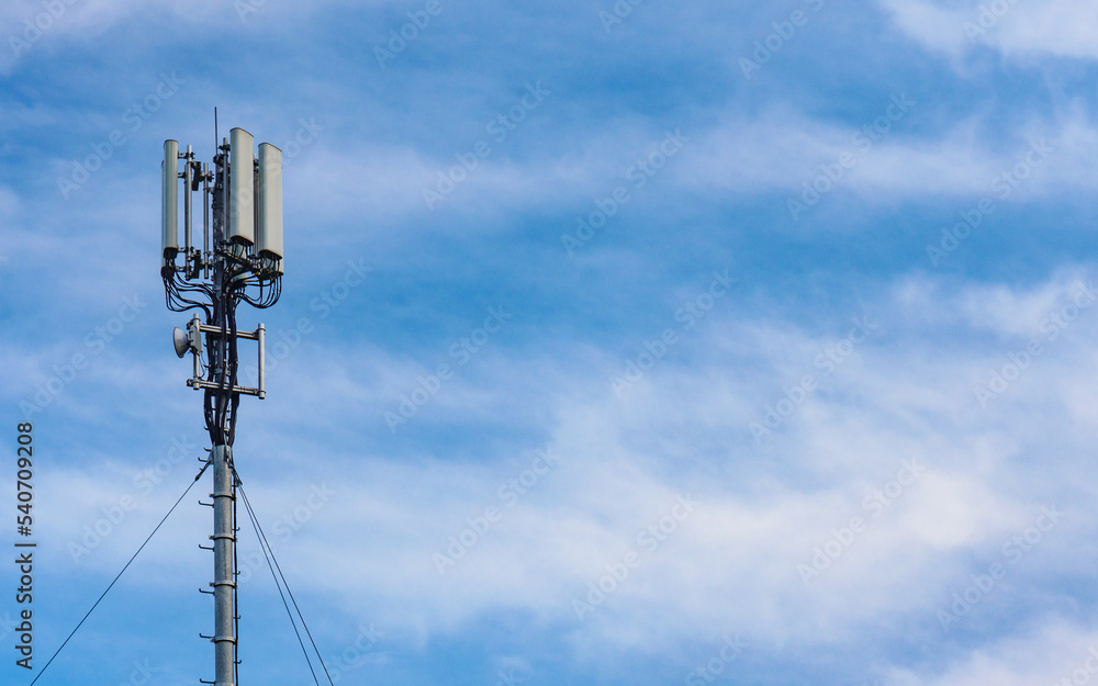 Cellular network antenna against blue sky. Cellular network antenna against blue sky.