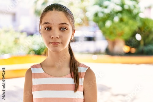 Fotografie Young teenager girl outdoors on a sunny day thinking attitude and sober expressi
